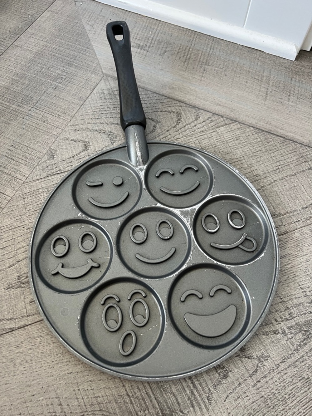 Nordic Ware Silver Seven-Cavity Pancake Pan with Black Handle